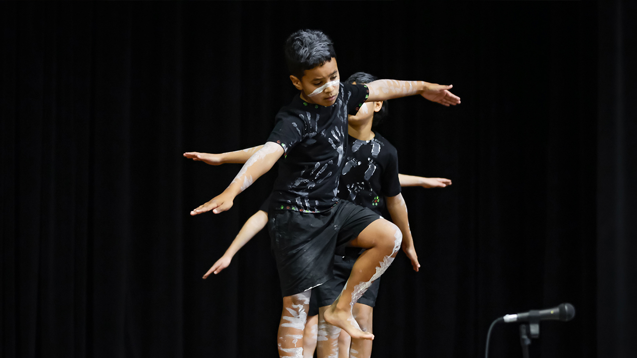 Children participating in traditional First Nations dance performance.