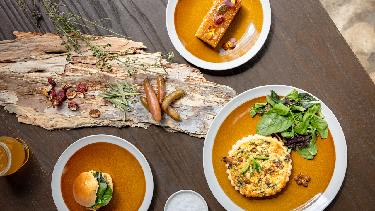 A flay lay of a range of dishes on a wooden table from Warakirri by Indigiearth